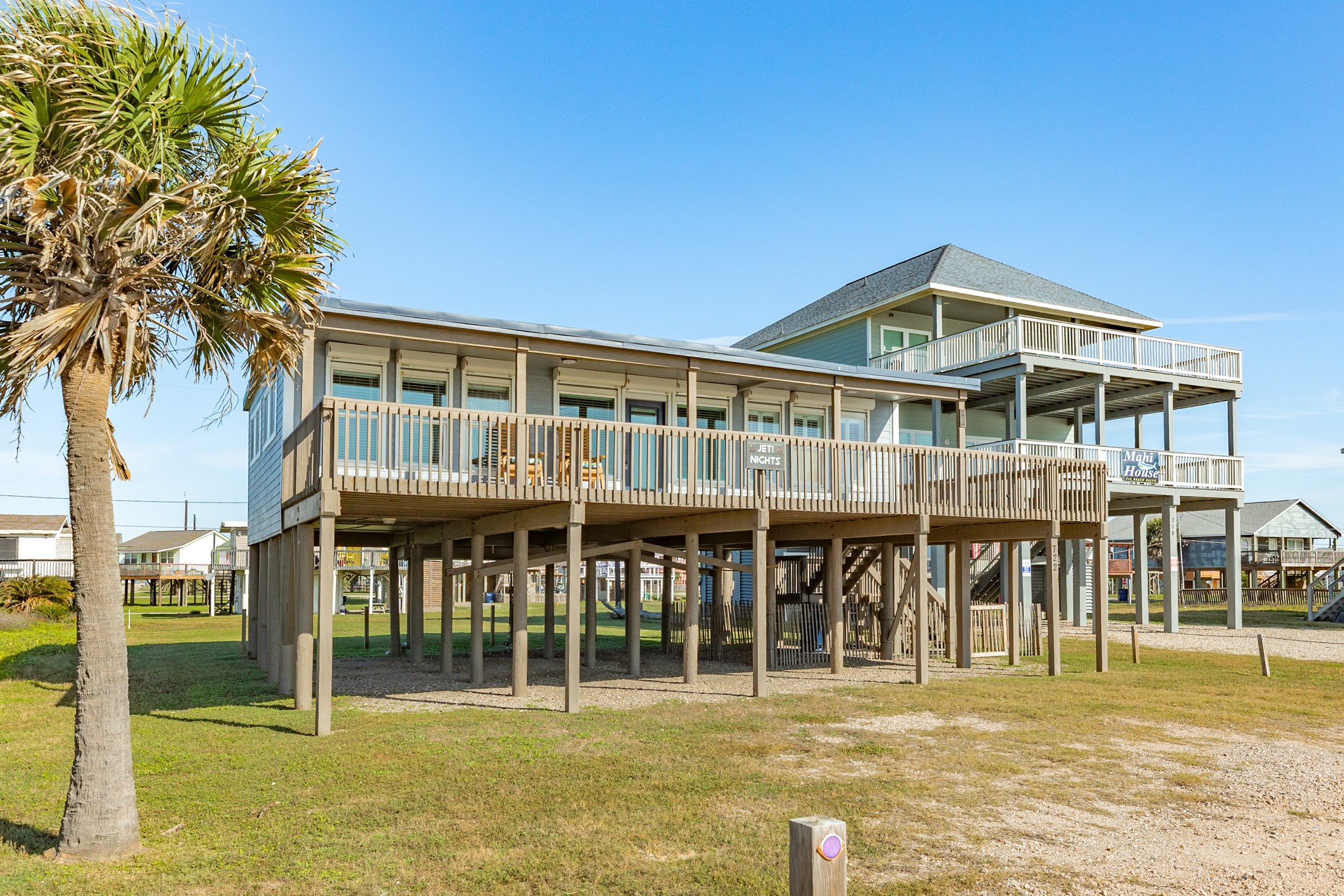 722 Beach Drive Surfside Beach, TX 77541 - Photo 27 of 34 a front view of a house with a yard
