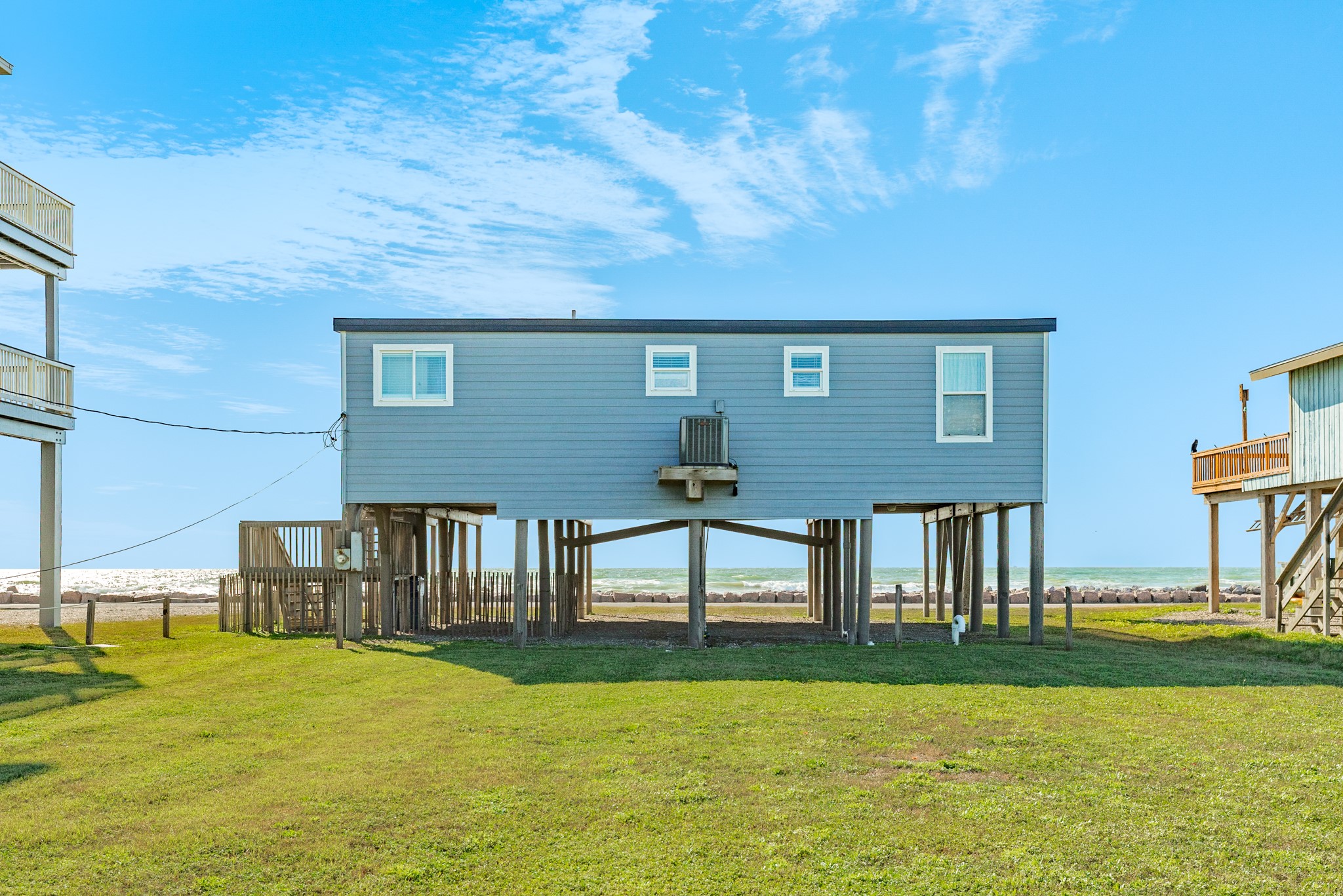 722 Beach Drive Surfside Beach, TX 77541 - Photo 34 of 34 a front view of a house with garden