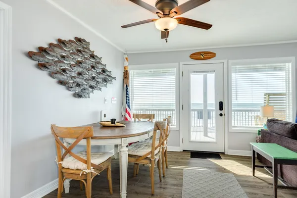 a dining room with furniture and window