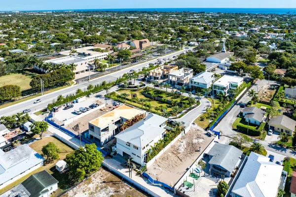 an aerial view of residential houses with outdoor space