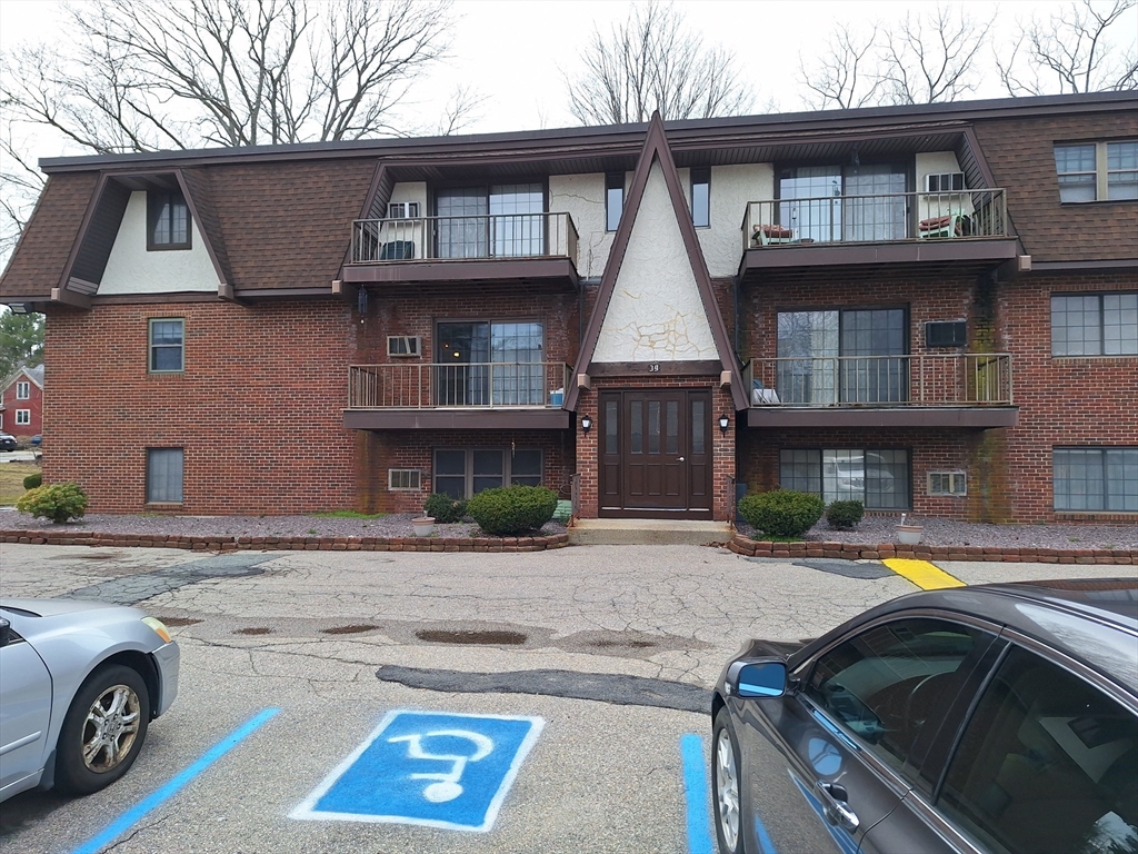 39 West Street, Unit B1 Randolph, MA 02368 - Photo 1 of 15 a front view of a house with parking space