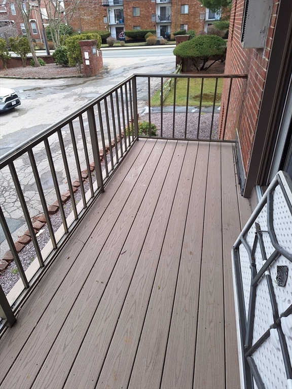 39 West Street, Unit B1 Randolph, MA 02368 - Photo 3 of 15 a view of balcony with wooden floor