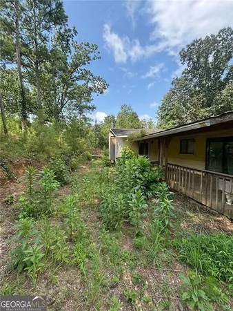 a backyard of a house with lots of green space