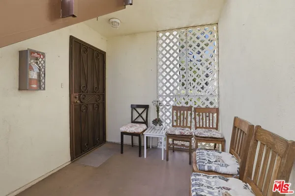 a balcony with furniture