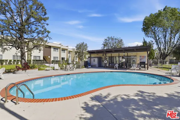 a view of swimming pool and outdoor seating