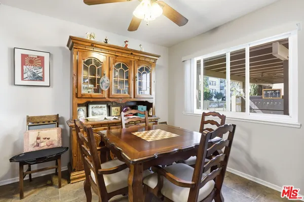 a view of a dining room with furniture window and outside view