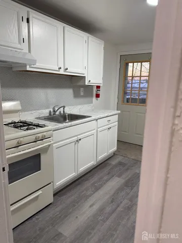 a view of a hallway with a window