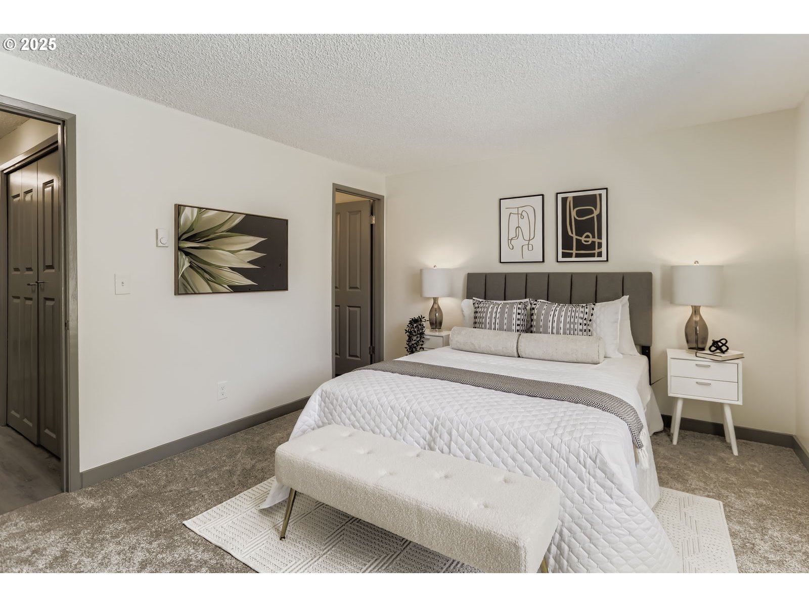650 Southwest Meadow Drive, Unit 106 Beaverton, OR 97006 - Photo 13 of 29 a bedroom with a bed and a painting on the wall