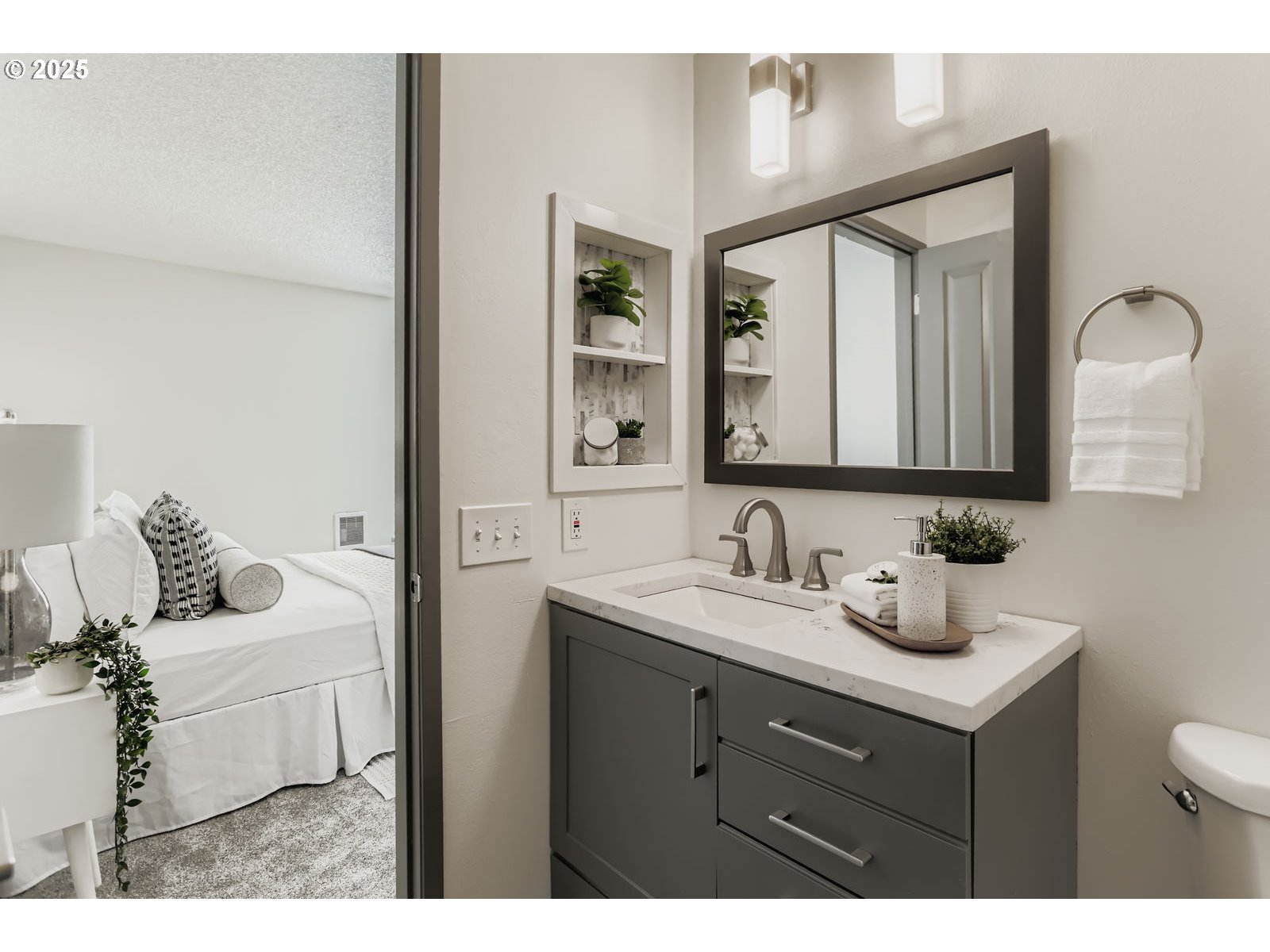 650 Southwest Meadow Drive, Unit 106 Beaverton, OR 97006 - Photo 16 of 29 a bathroom with a sink vanity and mirror