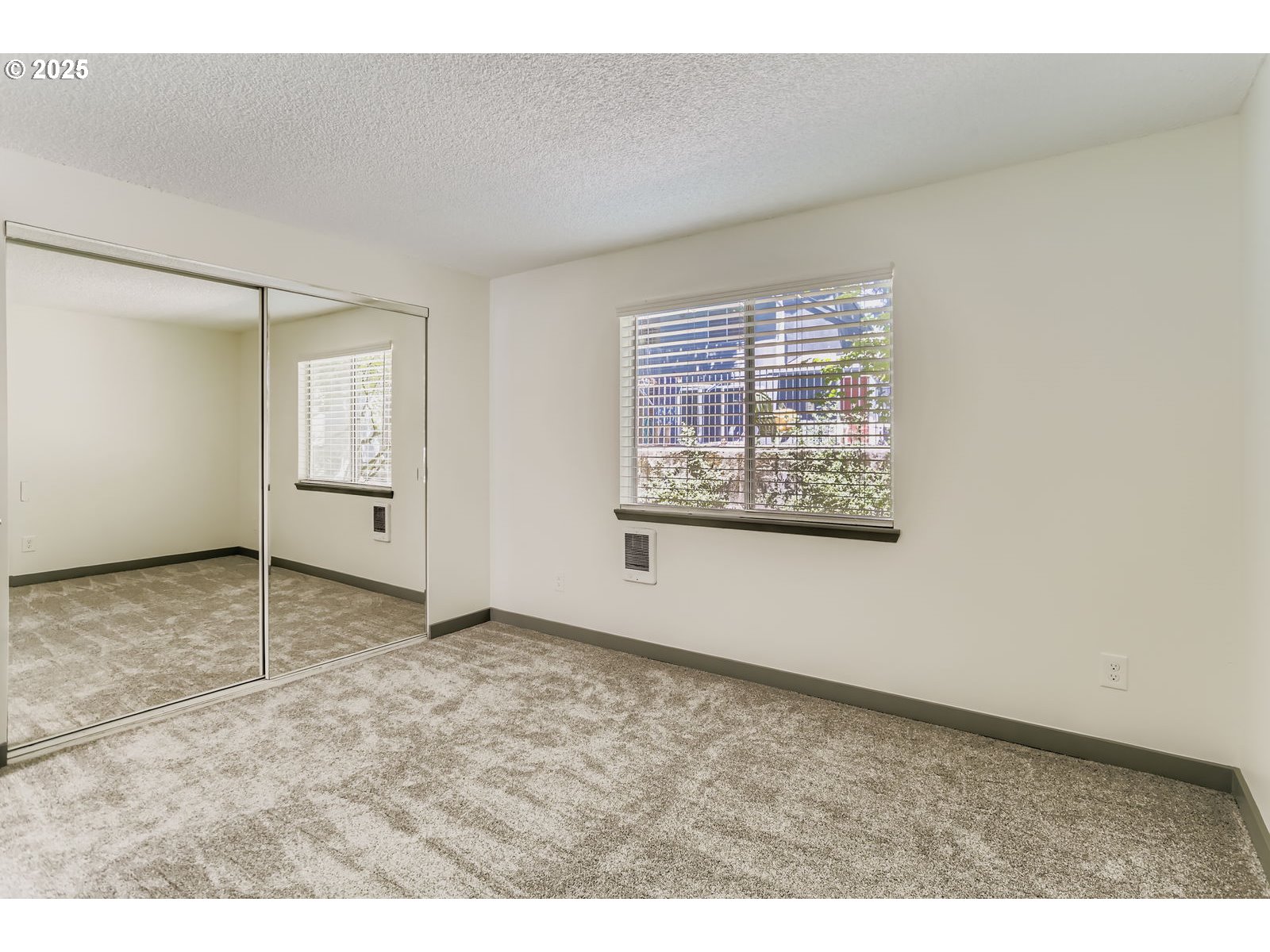 650 Southwest Meadow Drive, Unit 106 Beaverton, OR 97006 - Photo 17 of 29 an empty room with windows