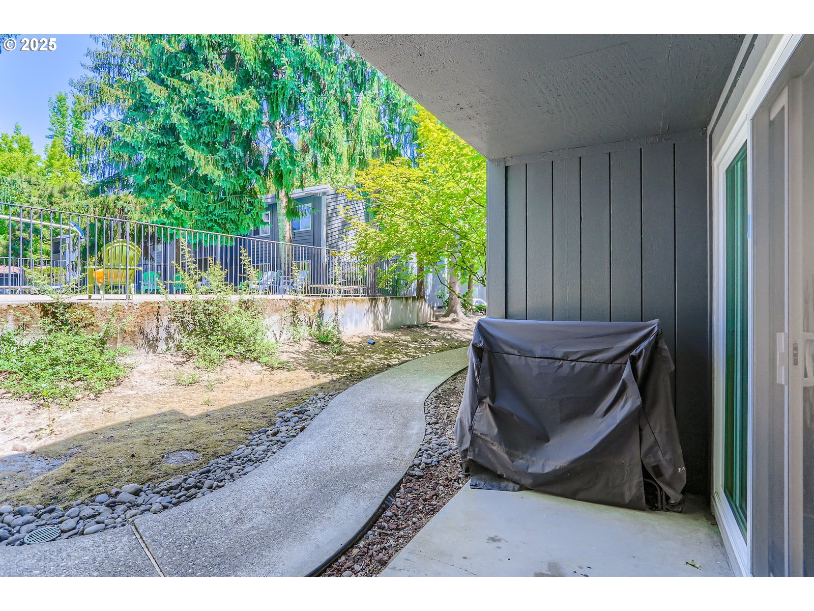 650 Southwest Meadow Drive, Unit 106 Beaverton, OR 97006 - Photo 20 of 29 a wooden bench sitting in front of a house