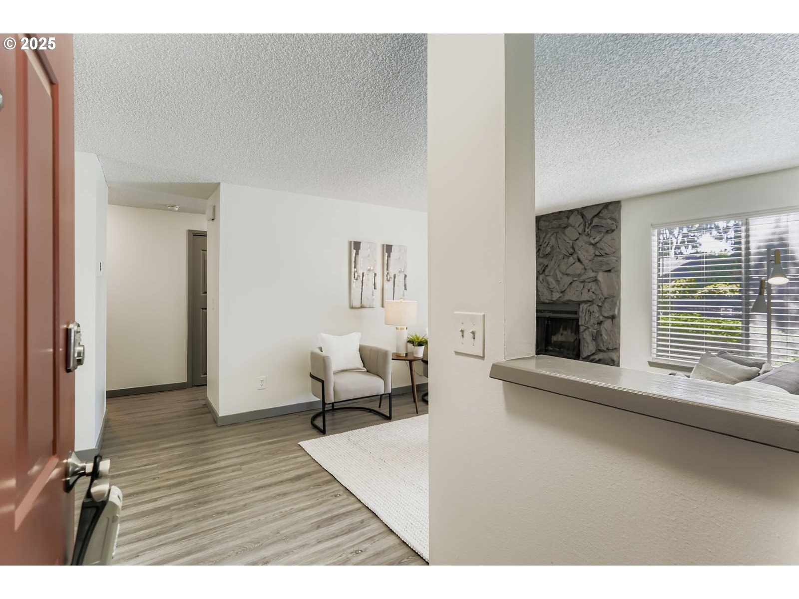 650 Southwest Meadow Drive, Unit 106 Beaverton, OR 97006 - Photo 2 of 29 a living room with furniture window and wooden floor