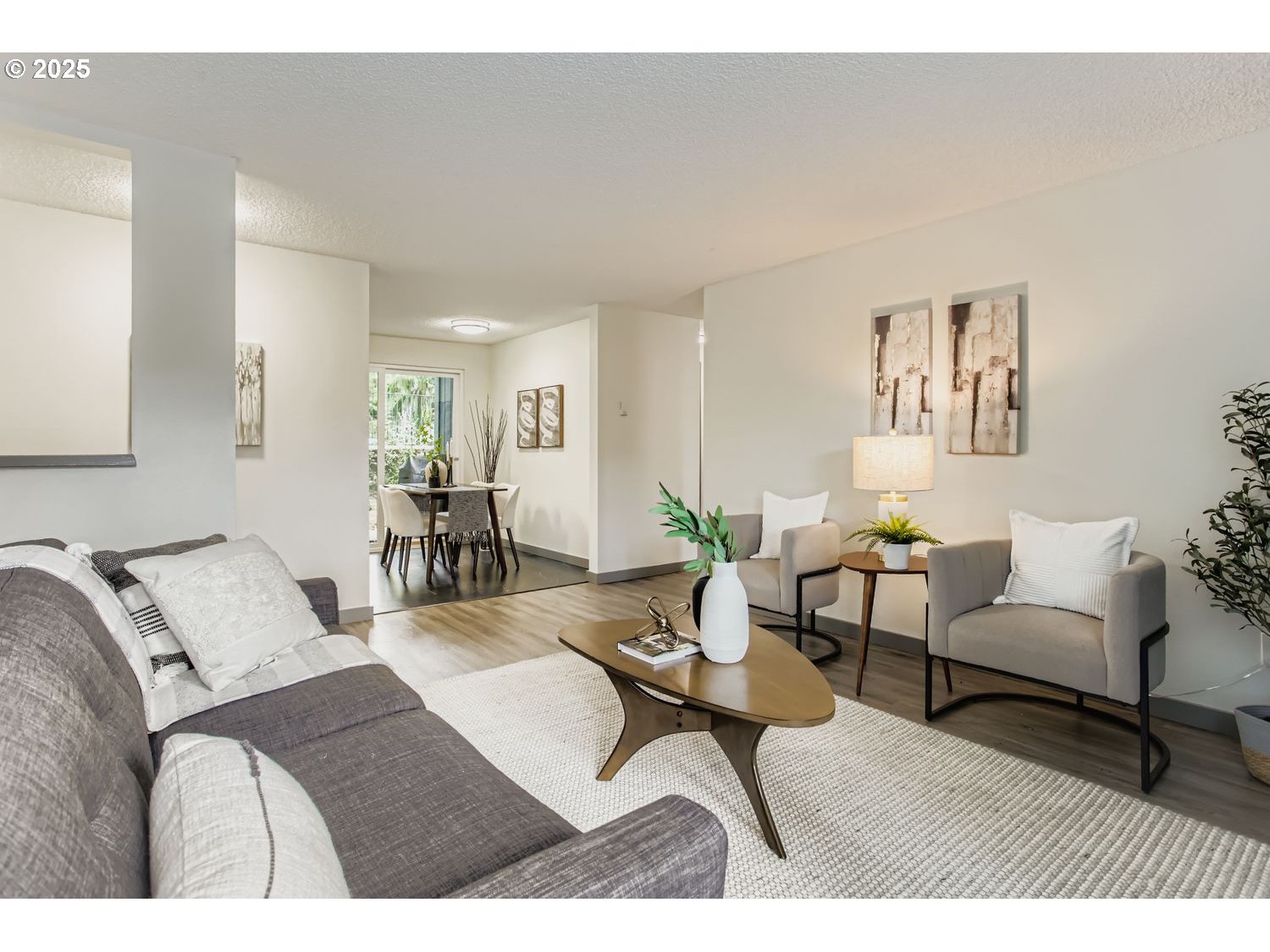 650 Southwest Meadow Drive, Unit 106 Beaverton, OR 97006 - Photo 29 of 29 a living room with furniture and wooden floor