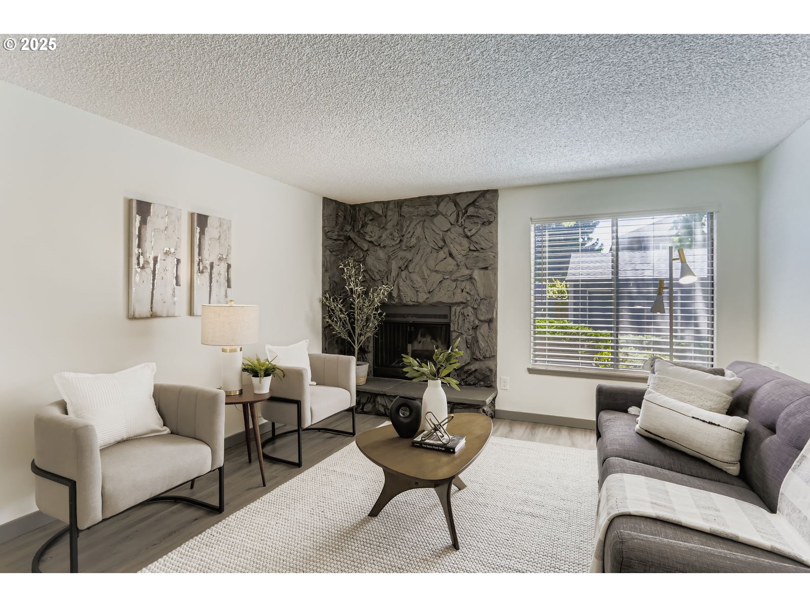 650 Southwest Meadow Drive, Unit 106 Beaverton, OR 97006 - Photo 4 of 29 a living room with furniture and a fireplace