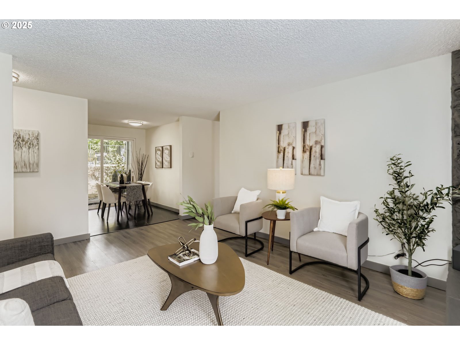 650 Southwest Meadow Drive, Unit 106 Beaverton, OR 97006 - Photo 5 of 29 a living room with furniture and a potted plant