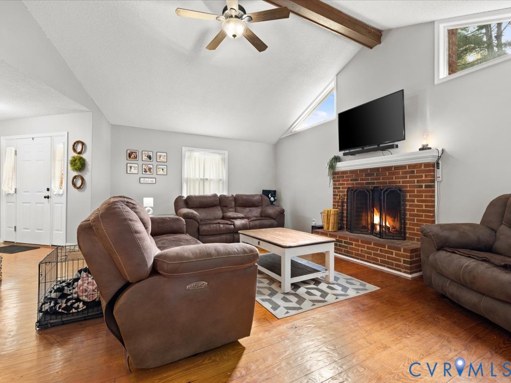 12724 South Chester Road Chester, VA 23831 - Photo 9 of 37 Brick wood burning fireplace with metal screen, wo