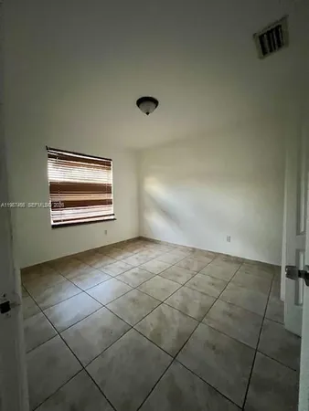 a bathroom with a bathtub and toilet