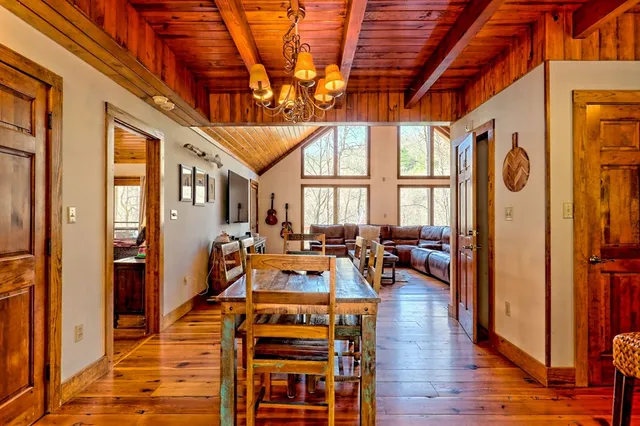 a view of house with a yard