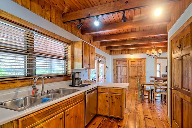 a roof deck with table and chairs