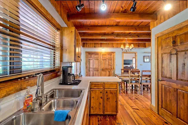 a view of an entryway with wooden floor and stairs