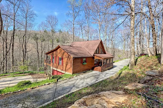 a living room with fireplace furniture and a wooden floor