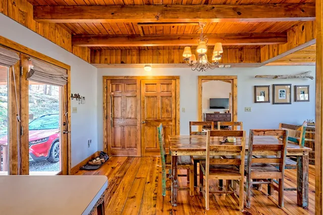 a living room with fireplace furniture and a flat screen tv
