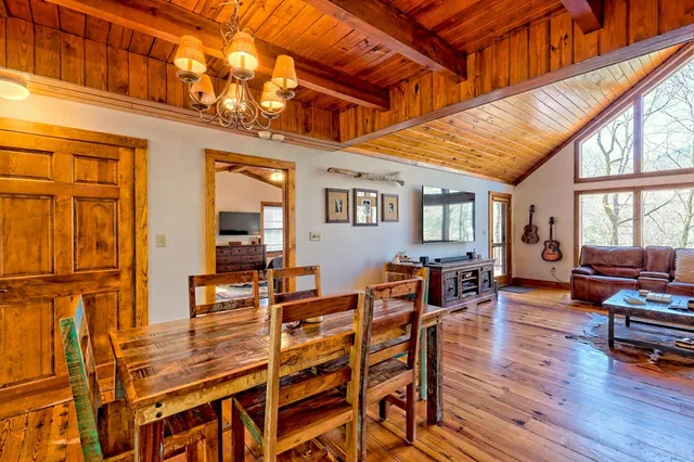 a bed room with a bed couch and a window