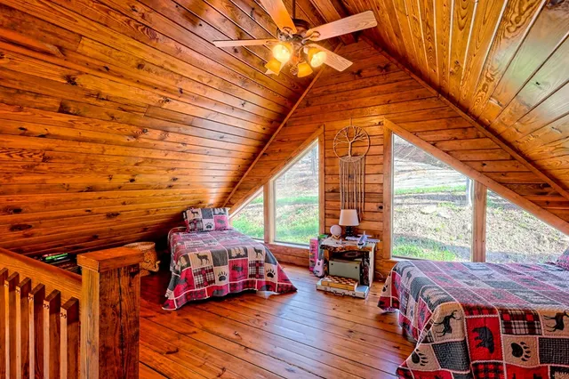 a living room filled with furniture and wooden floor