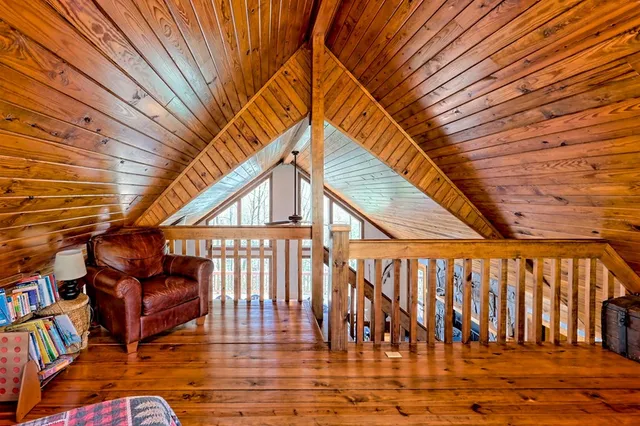 a bedroom with furniture and a flat screen tv