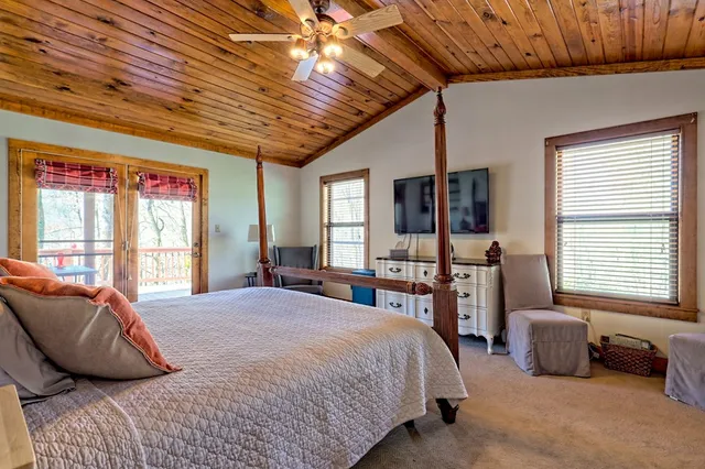 a view of balcony with wooden floor and seating space