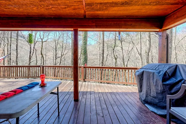 a bedroom with a bed and wooden floors