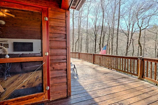 a spacious bedroom with two beds and painting on the wall