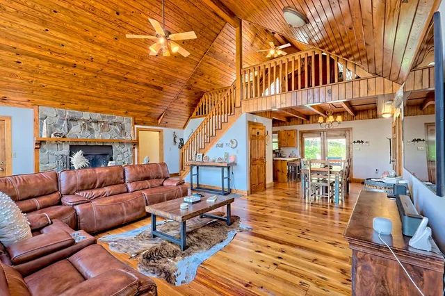 a balcony with wooden floor and fence