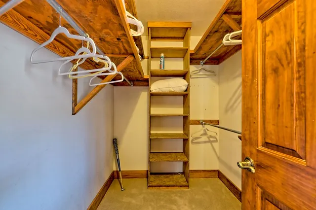 a view of porch with two chairs and a yard