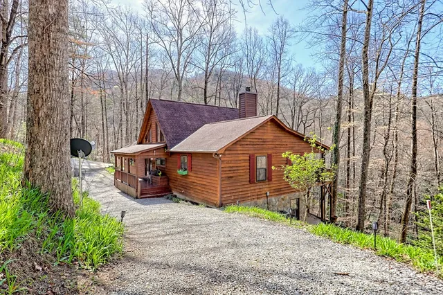 a dining room with furniture water view and wooden floor