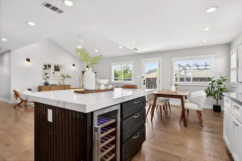 a view of kitchen island a sink and living room
