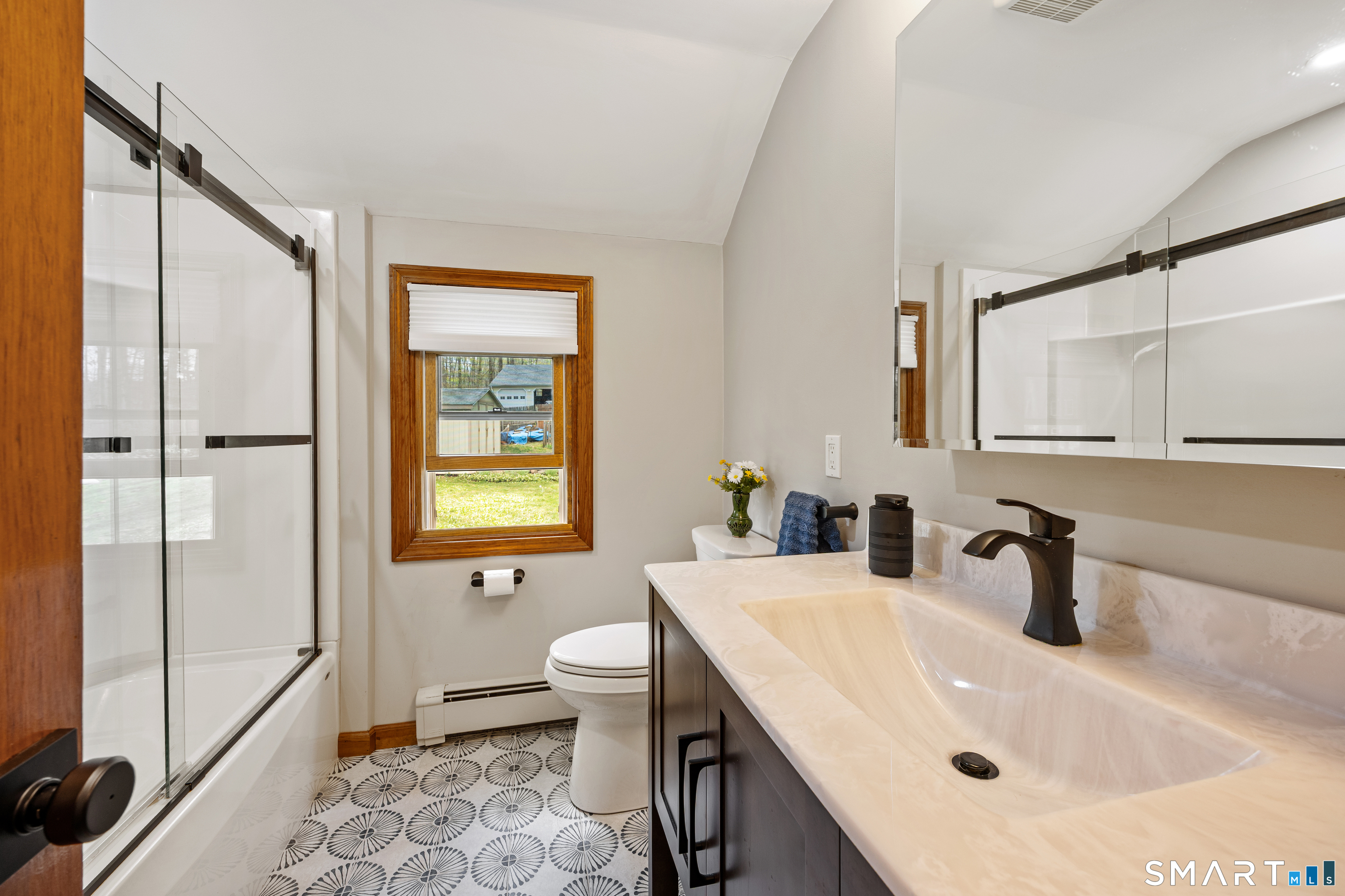 42 Chimney Sweep Road Wallingford, CT 06492 - Photo 21 of 40 a bathroom with a sink a toilet and shower
