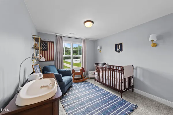 a bedroom with furniture and windows