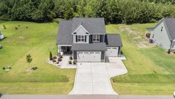a aerial view of a house with a yard