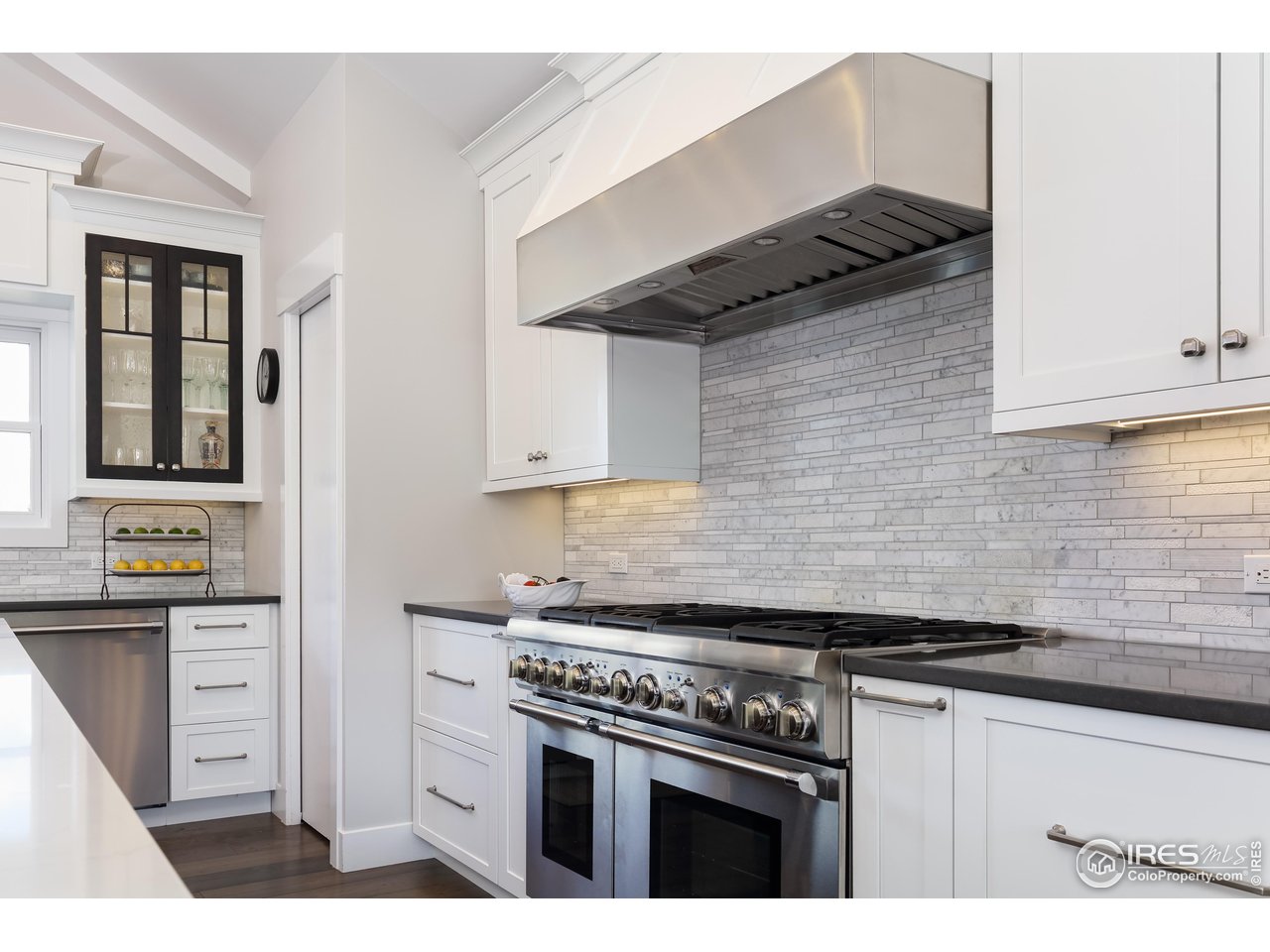 709 Baseline Road Boulder, CO 80302 - Photo 14 of 40 a kitchen with granite countertop a stove and a cabinets