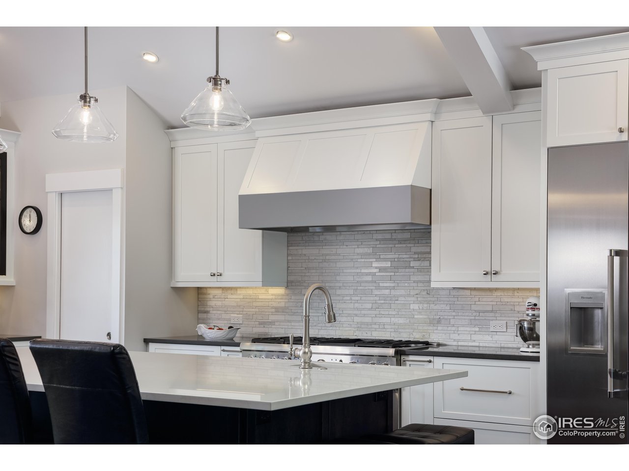709 Baseline Road Boulder, CO 80302 - Photo 15 of 40 a kitchen with kitchen island a sink stainless steel appliances and cabinets