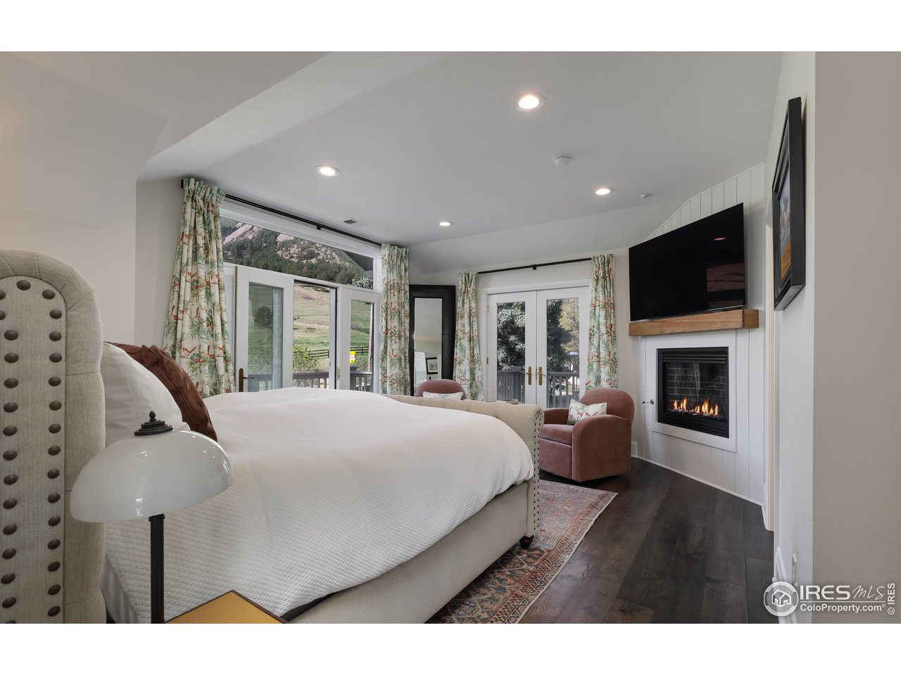 709 Baseline Road Boulder, CO 80302 - Photo 23 of 40 a living room with furniture and a flat screen tv