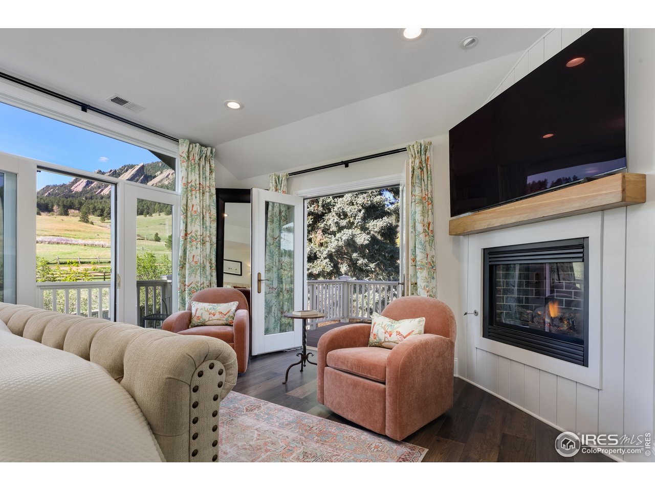 709 Baseline Road Boulder, CO 80302 - Photo 25 of 40 a living room with furniture a large window and a fireplace