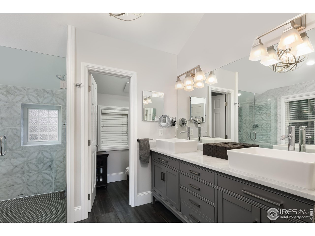 709 Baseline Road Boulder, CO 80302 - Photo 29 of 40 a bathroom with a double vanity sink and a mirror