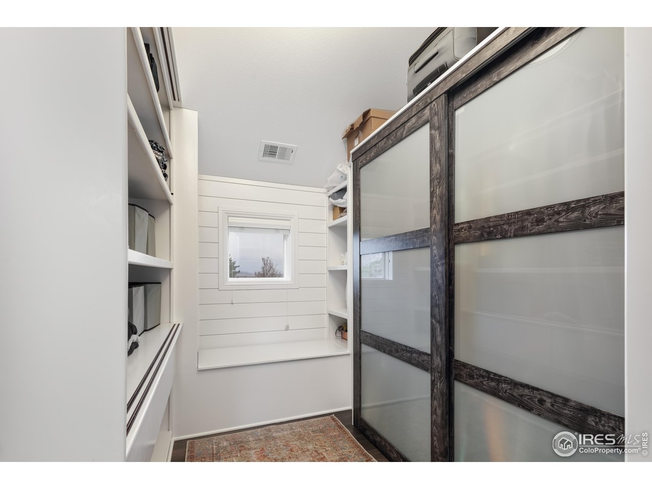 709 Baseline Road Boulder, CO 80302 - Photo 30 of 40 a view of staircase with white walls and a window