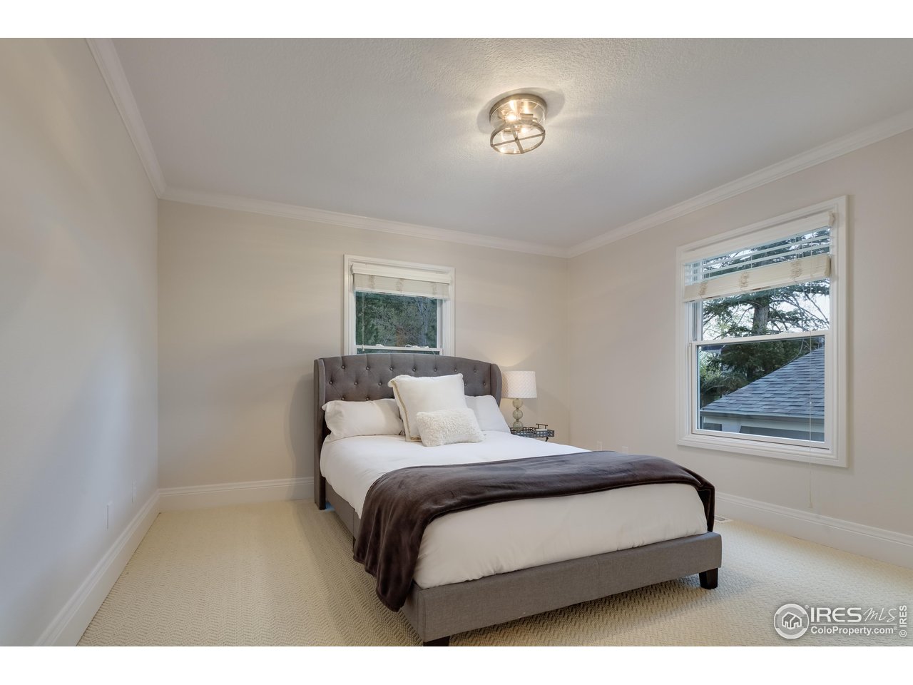 709 Baseline Road Boulder, CO 80302 - Photo 35 of 40 a bedroom with a bed and a window