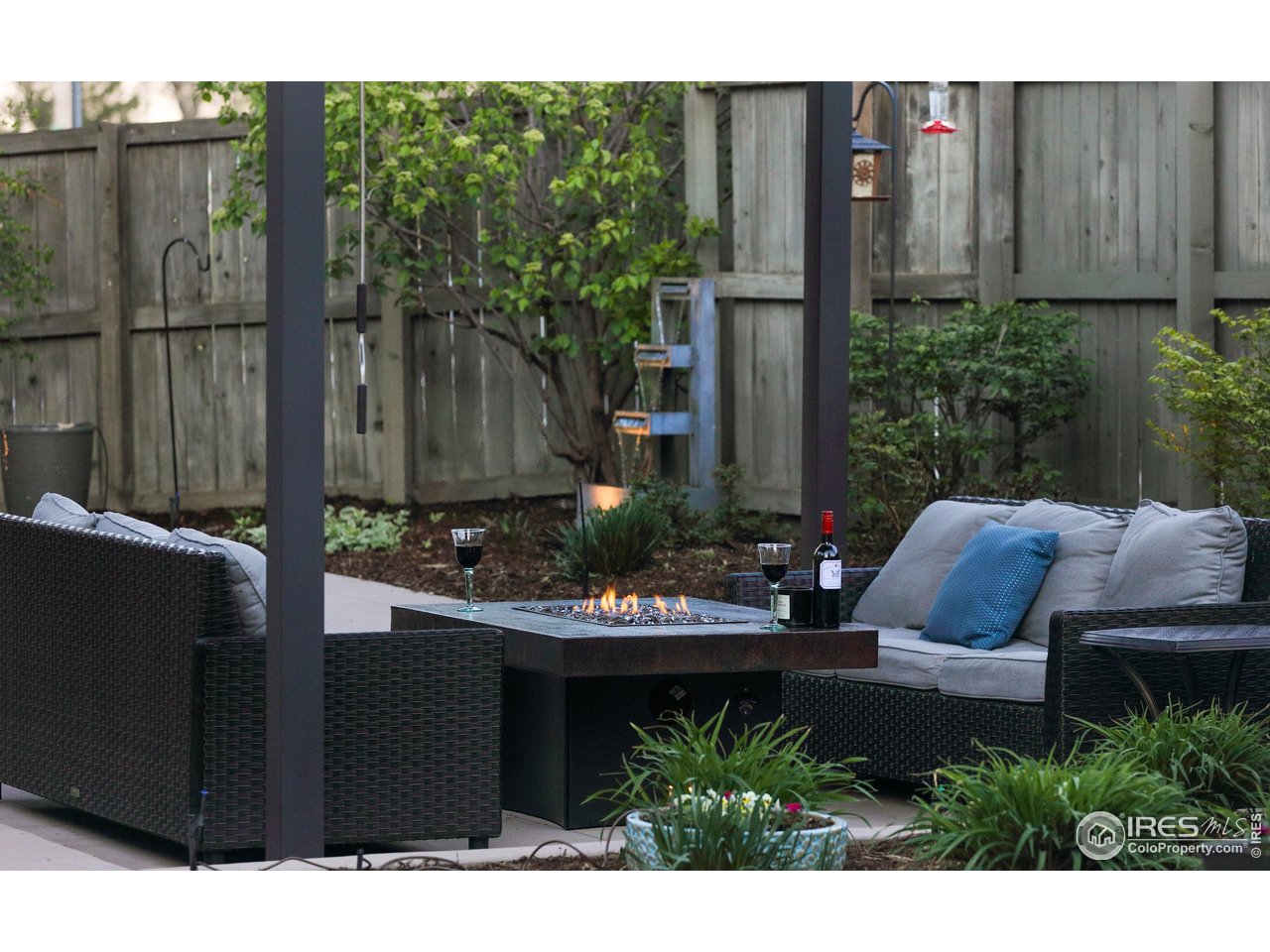 709 Baseline Road Boulder, CO 80302 - Photo 38 of 40 a view of a chairs and table in the back yard of a house