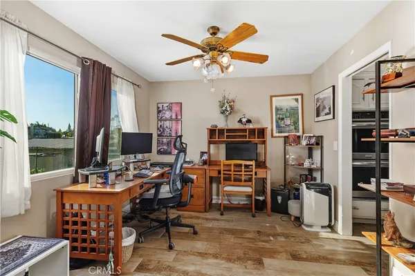 a work room with furniture and a window