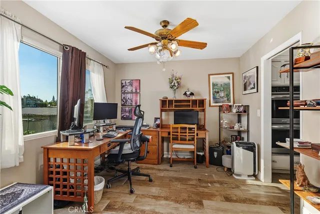a work room with furniture and a window