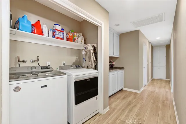 a utility room with washer and dryer